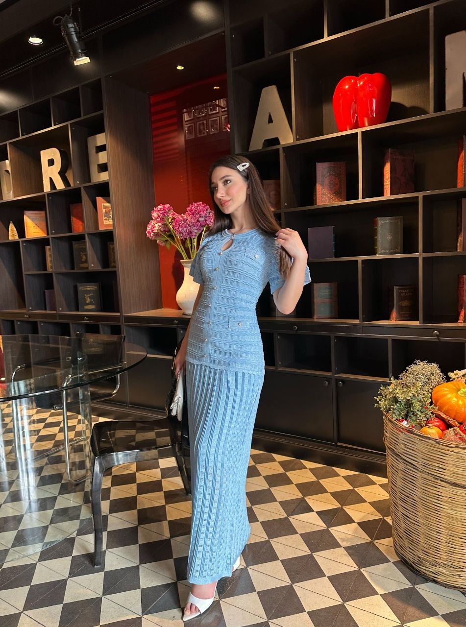 Blue Knitted dress with glitter and lining.