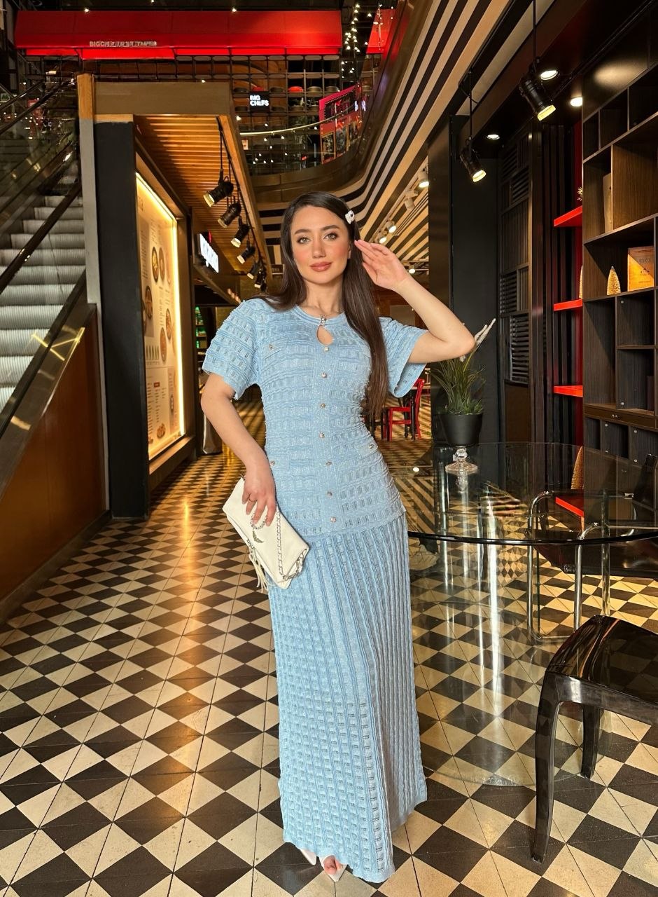 Blue Knitted dress with glitter and lining.