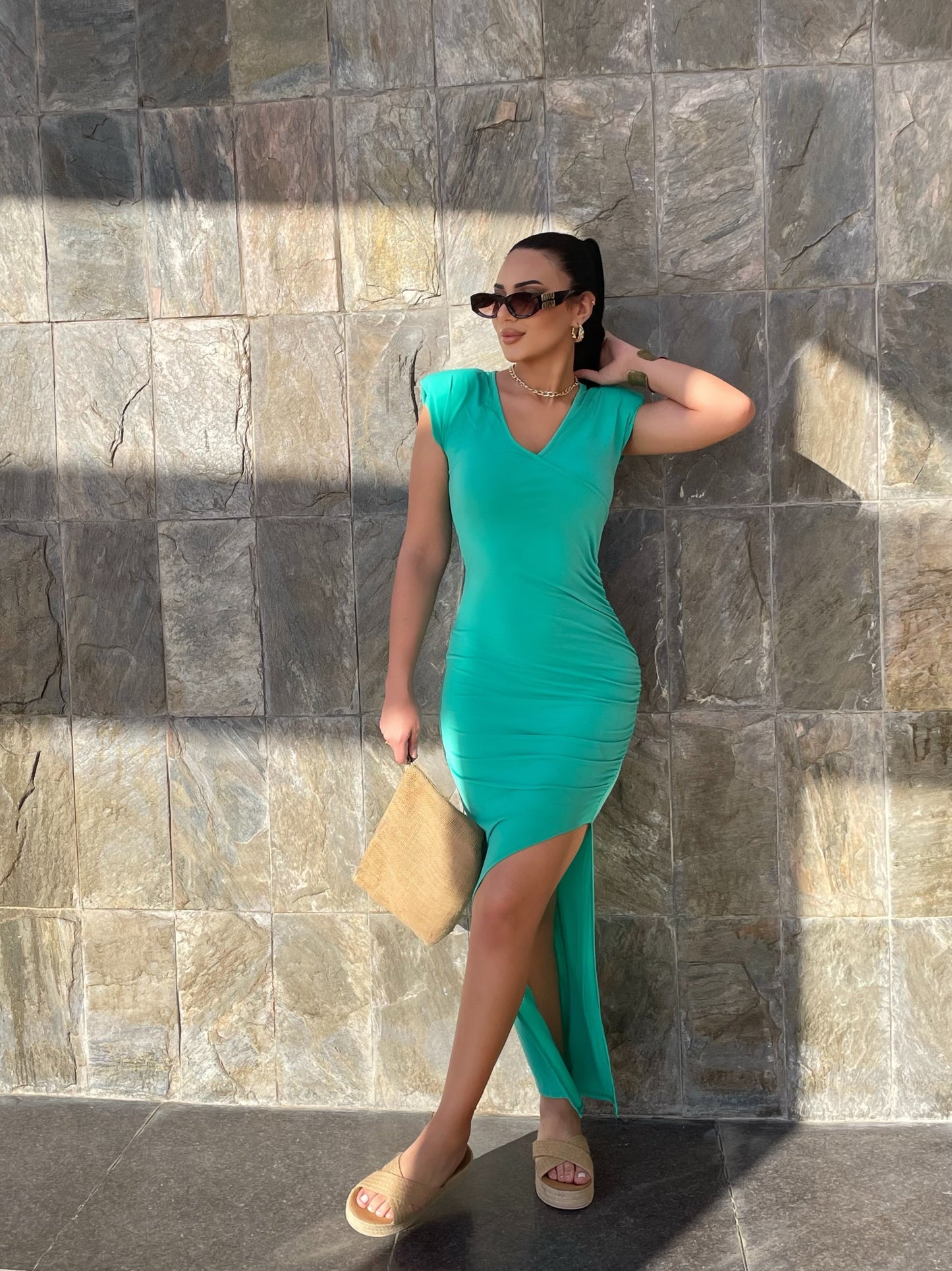 Green maxi length dress with gather detail on the chest and slit low-cut