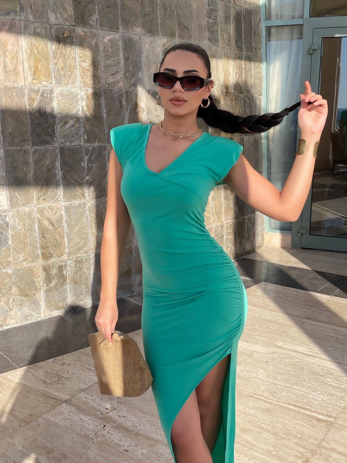 Green maxi length dress with gather detail on the chest and slit low-cut